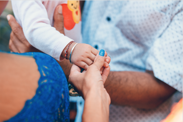 Parent holding child hand
